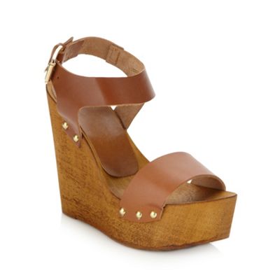 Tan high wooden wedge heeled sandals                                                                                            