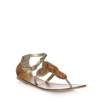 Gold flat beaded strapped sandals                                                                                               
