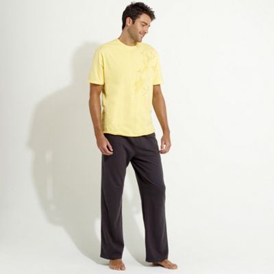 Yellow print t-shirt and grey jersey pants