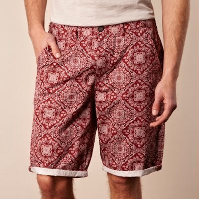 Red paisley patterned shorts                                                                                                    