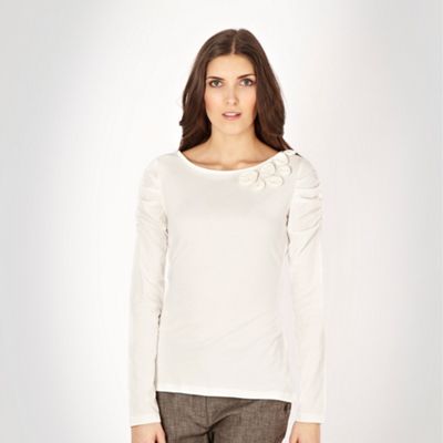 Ivory corsage ruffled shoulder jersey top