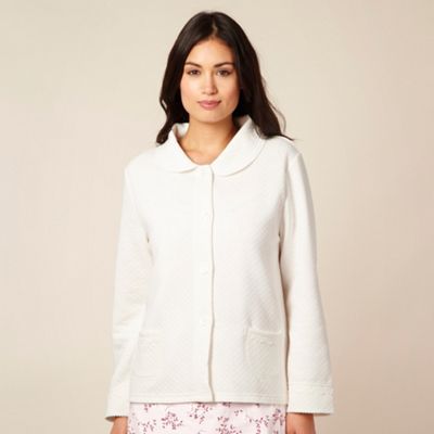 Cream quilted bed jacket                                                                                                        