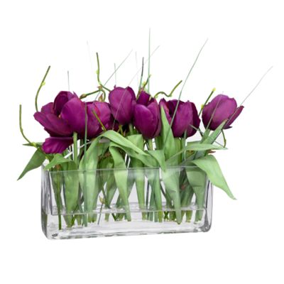 Purple tulips in planter glass