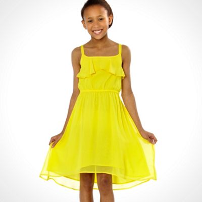 Girl's yellow strappy dip hem dress                                                                                             