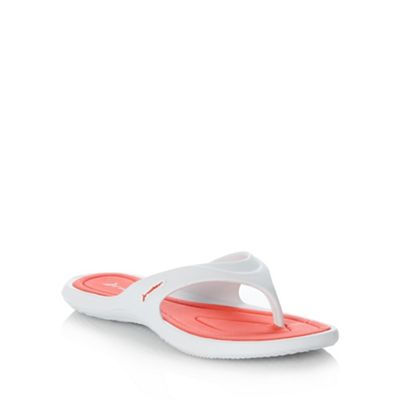 White and pink flip flops                                                                                                       