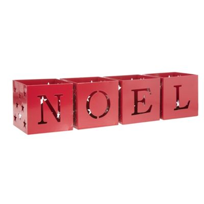 Set of four red cut out letter tea light holders