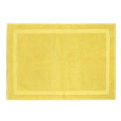 Light yellow geometric border bath mat